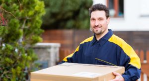 USA Couriers driver delivering box